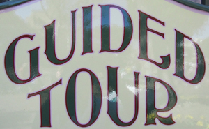 Sign at Guided Tour booth next to City Hall – Main Street
