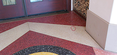 go to the Carthay Restaurant, next door is the entry to Restaurant 1901. Look down, the Hidden Mickey is in the cream stripe in the terrazzo flooring